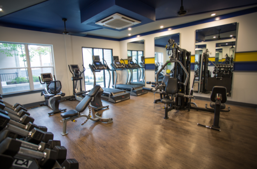 a room filled with lots of different types of exercise equipment