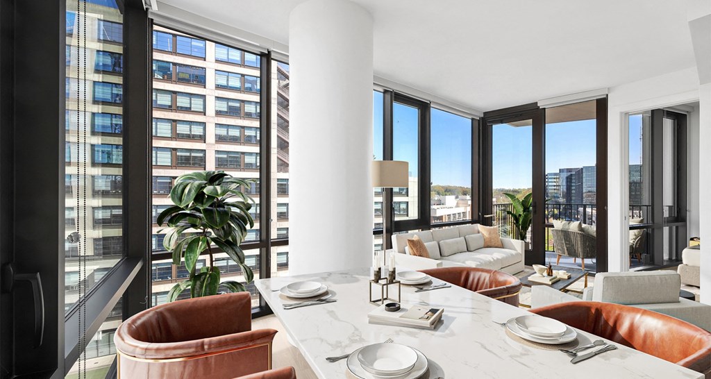 A modern dining room with a view of the city.