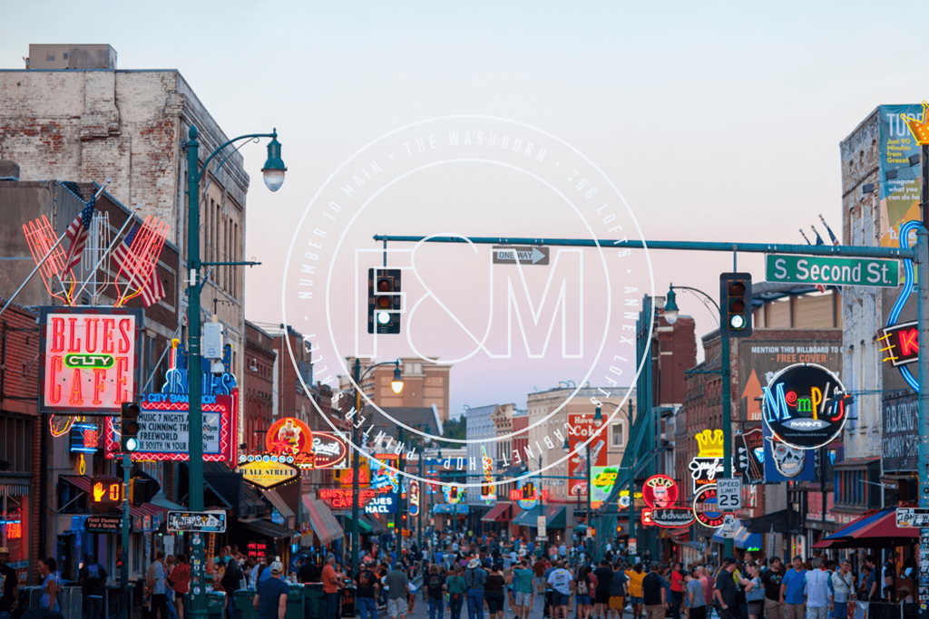 a crowd of people walking down a busy city street