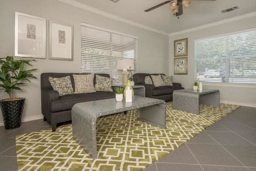 a living room with couches and a coffee table