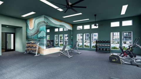 A gym with a ceiling fan and exercise equipment.