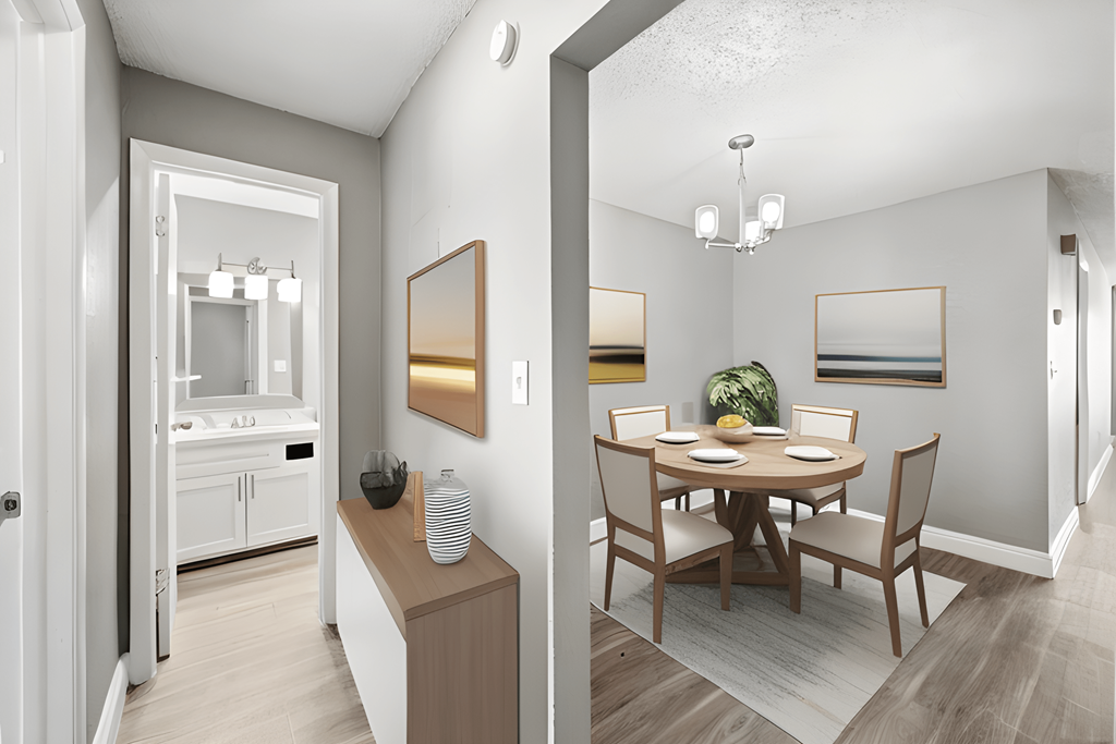 a living room and a dining room with a table and chairs
