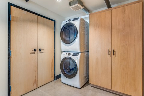 A washing machine and dryer in a laundry room.