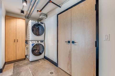 A laundry room with a washer and dryer in it.