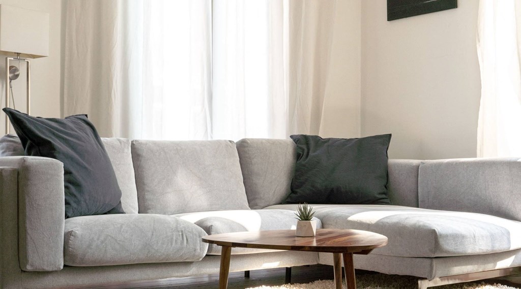 a living room with a couch and a coffee table