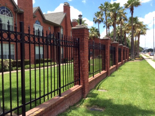 a wrought iron fence in front of a home