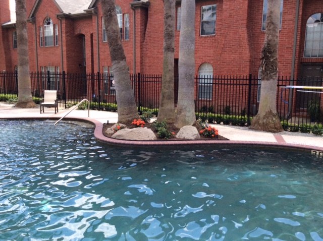 a swimming pool in front of a building