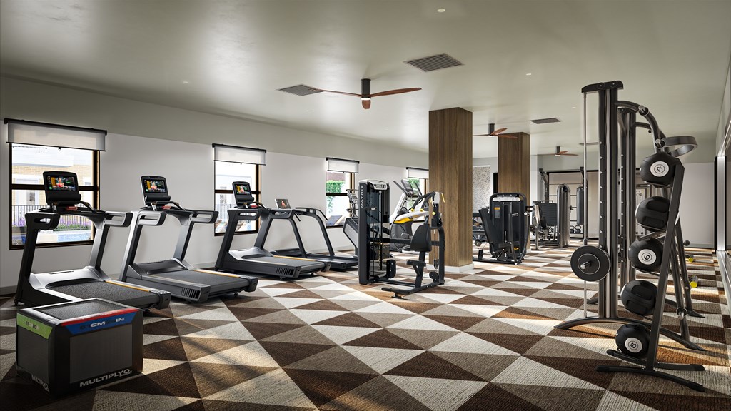 A gym with treadmills, weights, and exercise equipment.
