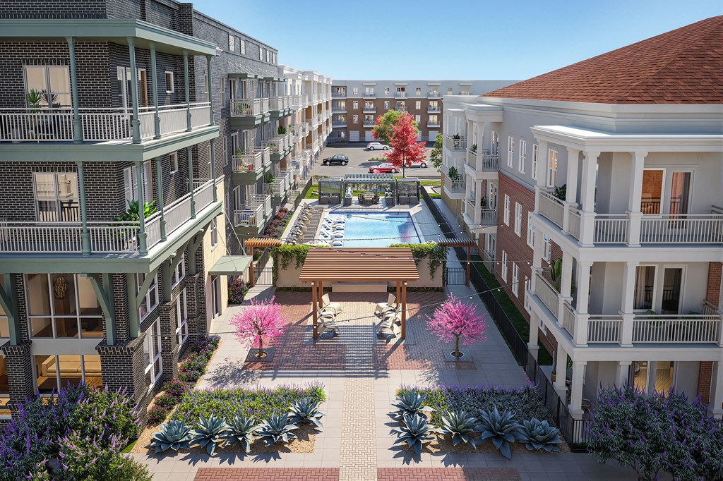 A view of a courtyard with a pool and a wooden bench.