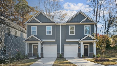 A two-story house with a grey exterior and a white garage door.