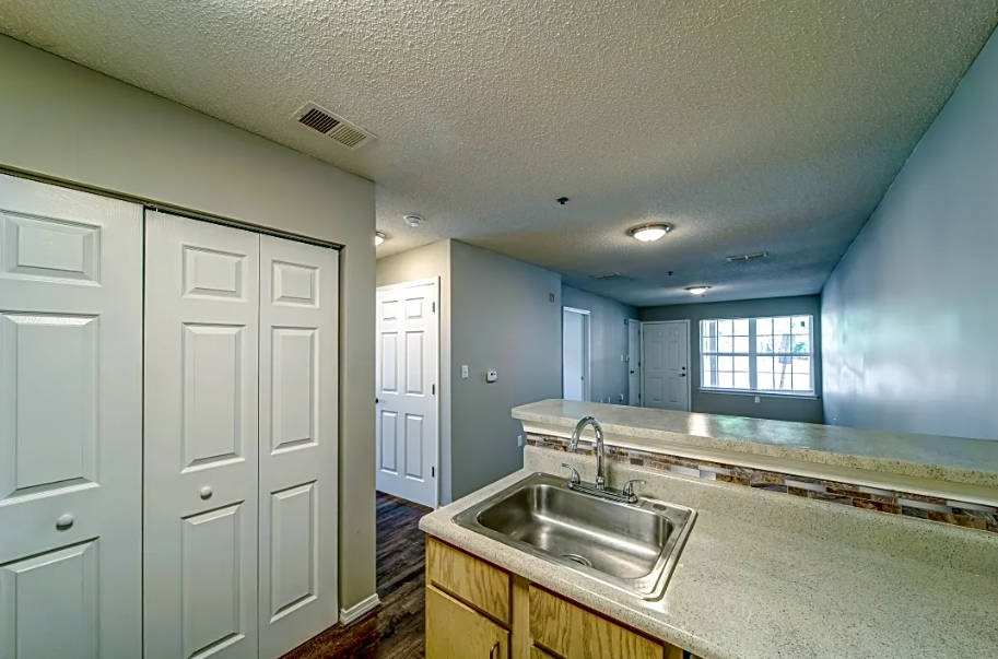 a kitchen with a sink and a counter top