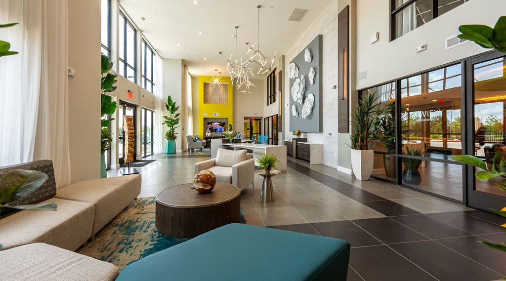 a lobby with couches and a table