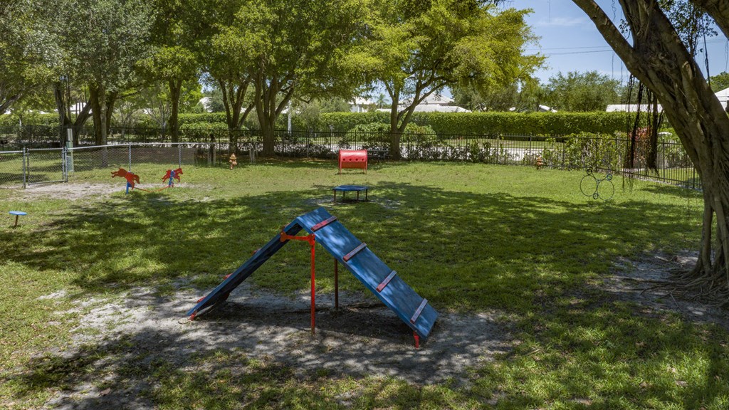 a swing set in a playground at a park