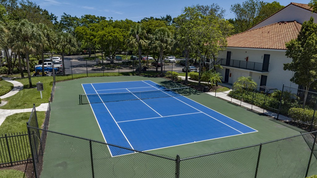 an aerial view of the tennis court at the resort
