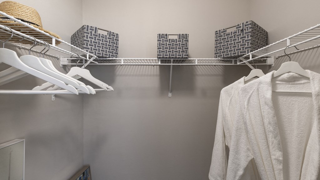 a walk in shower with three cages and a reflection in the water