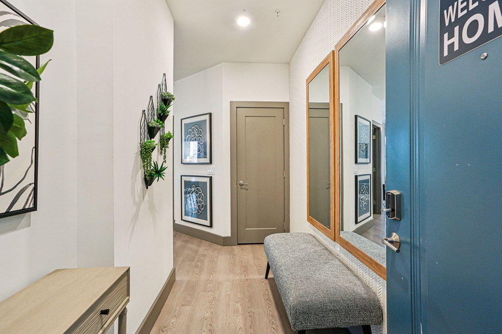 A hallway with a bench and a door with a sign that says "WEEKEND".