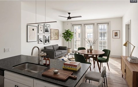 A modern kitchen with a dining table and chairs.