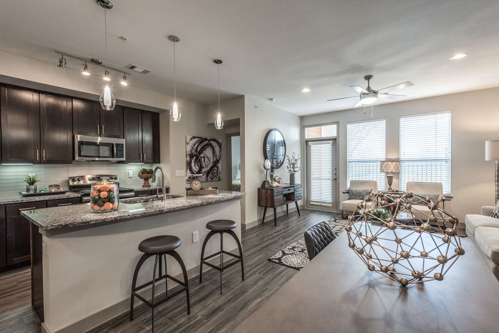 an open floor plan with a kitchen and living room