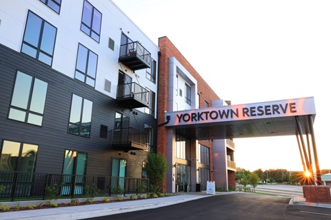 The entrance to the Yorktown Reserve building with a sign above it.
