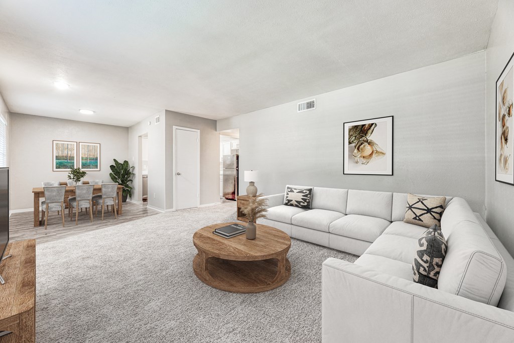a living room with a white couch and a table