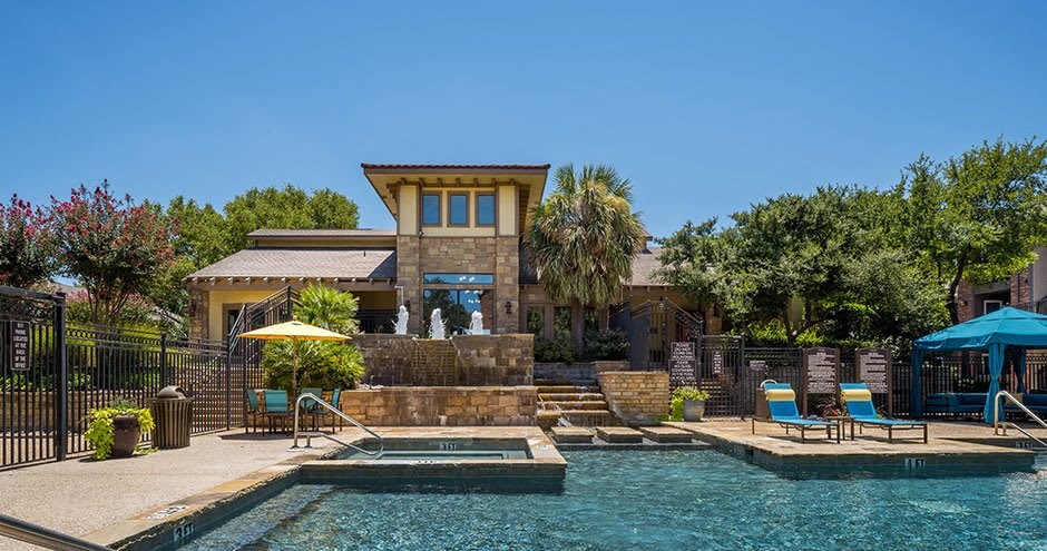 a pool and a house with a swimming pool