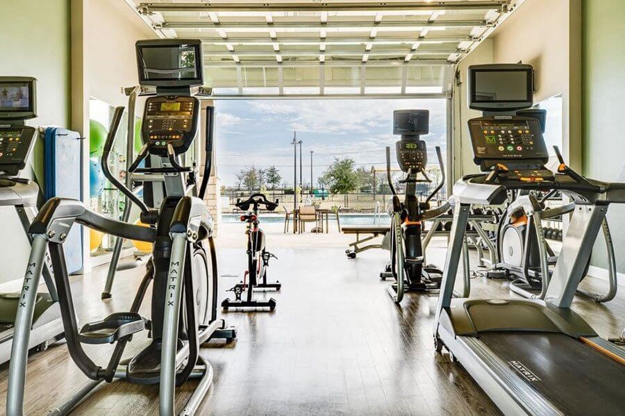 A gym with treadmills and exercise bikes.