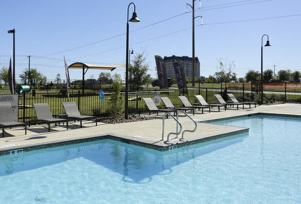 A pool with a sign that says "G FIT" on the side.