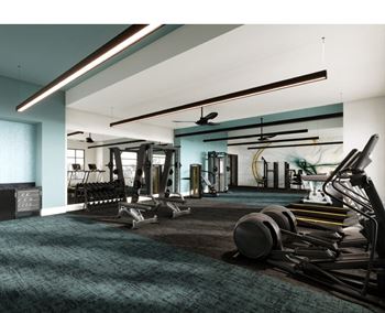 a gym with weights and a ceiling light