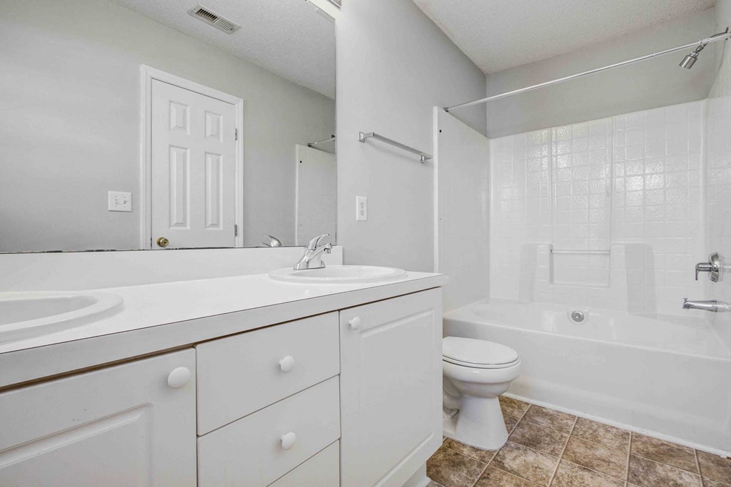 a bathroom with a sink toilet and a tub