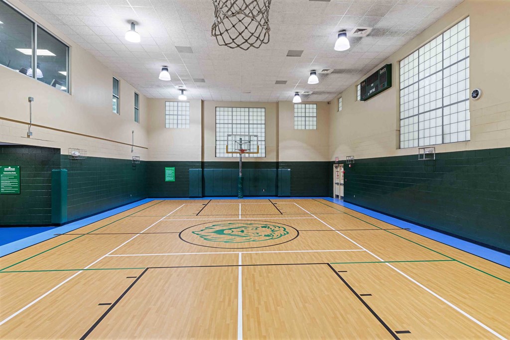 a basketball court in a gym at a community center