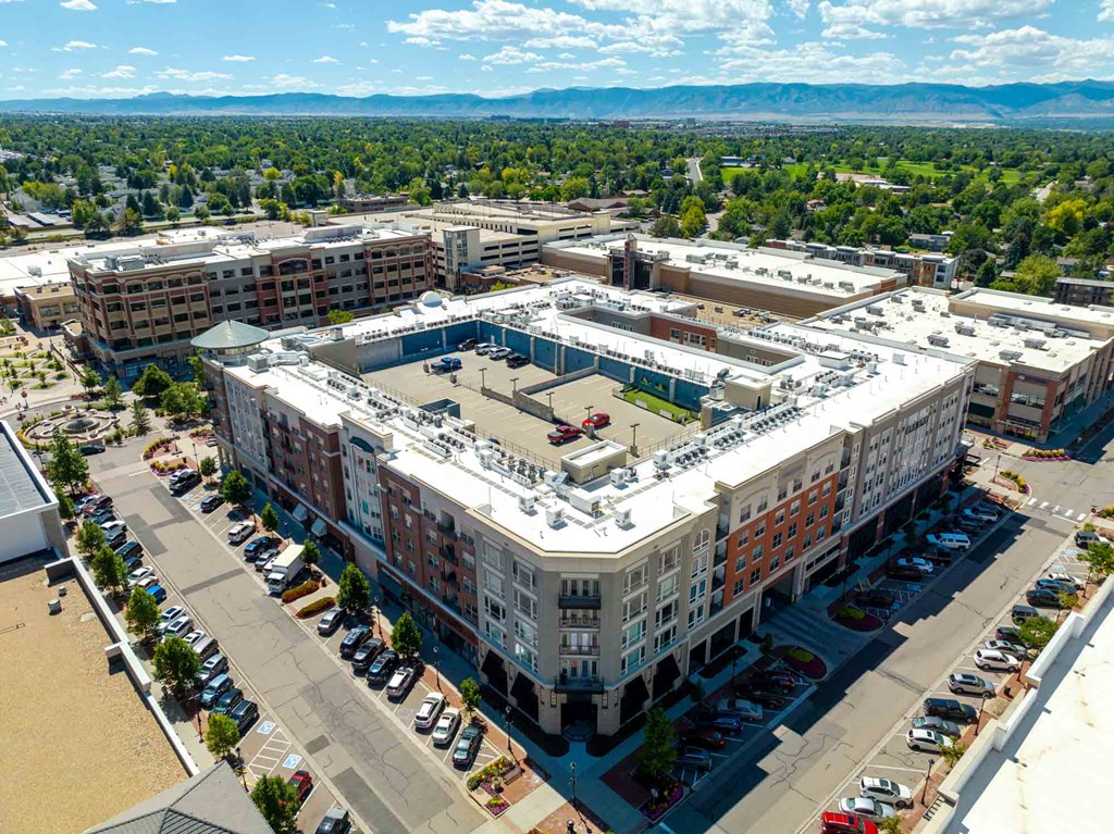 an aerial view of a large building in the middle of a city