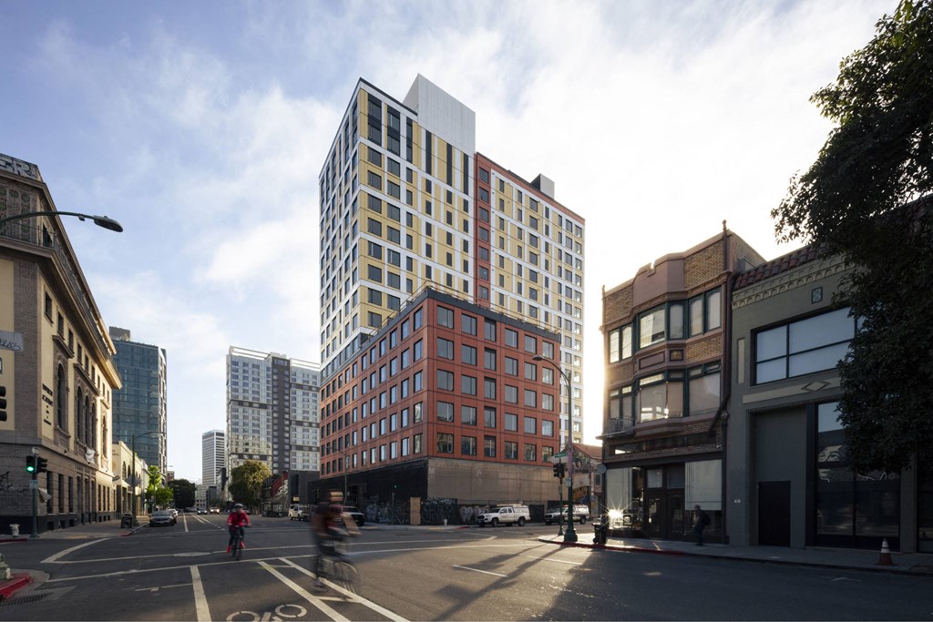 a rendering of a city street with tall buildings