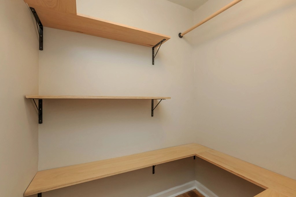 a walk in closet in a 555 waverly unit