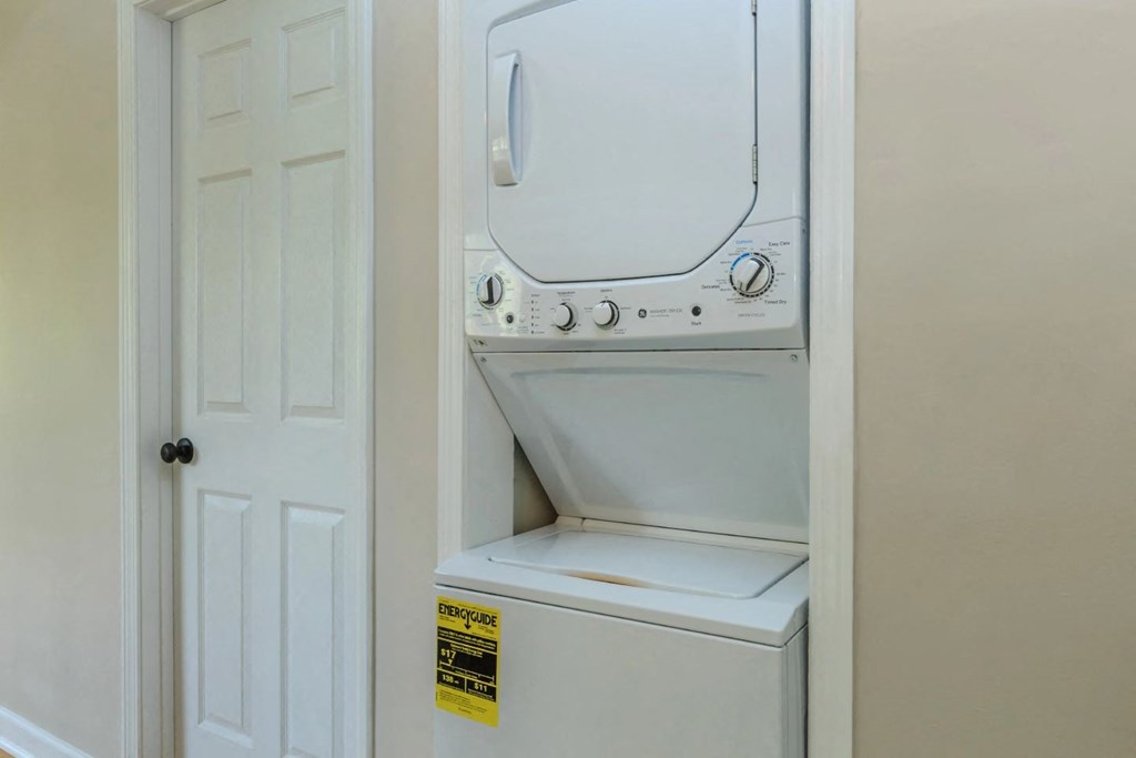 a washer and dryer are located in the laundry room