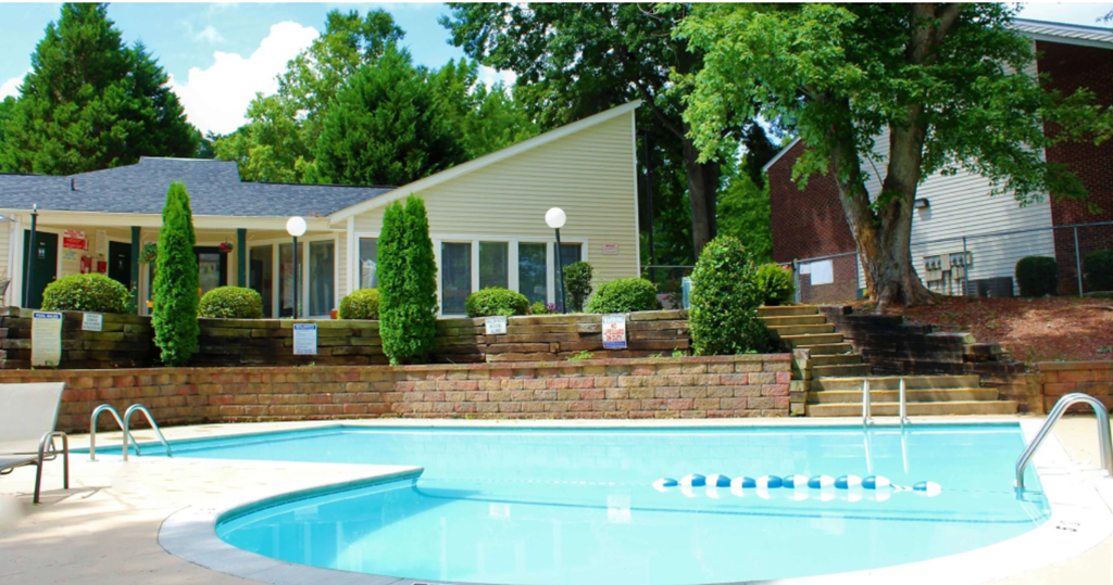 a swimming pool in front of a house