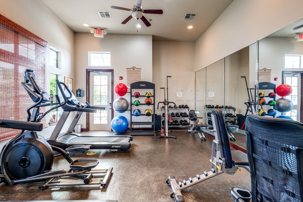 the gym with cardio equipment at the belgard apartments mn