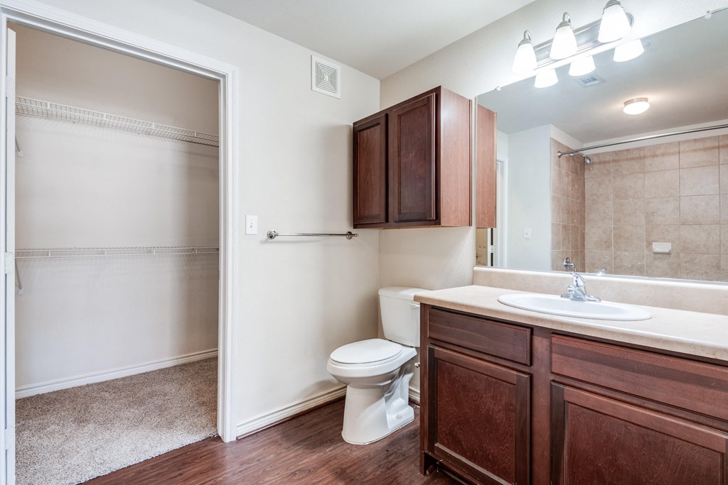 an empty bathroom with a toilet and a sink