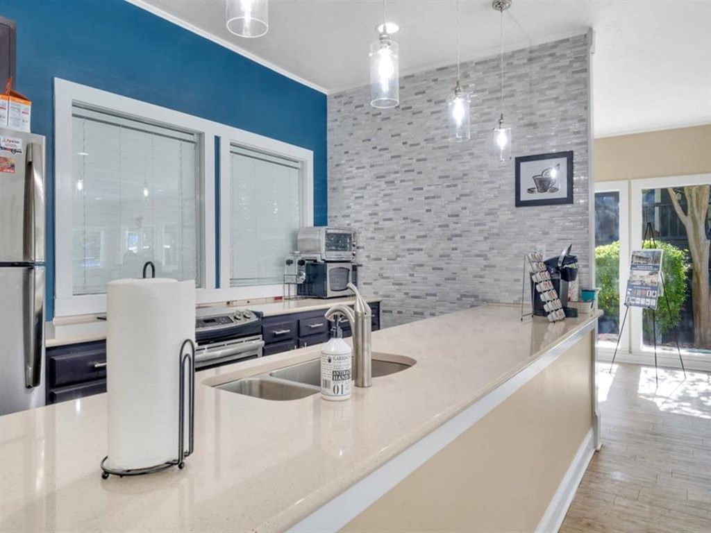 a kitchen with a counter top and a sink