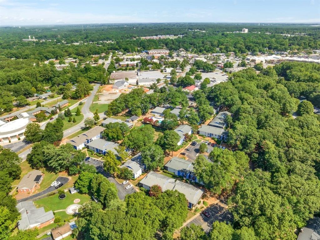 an aerial view of a neighborhood with houses and trees