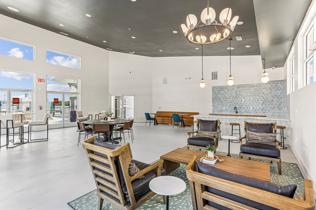 A large room with a lot of chairs and tables.