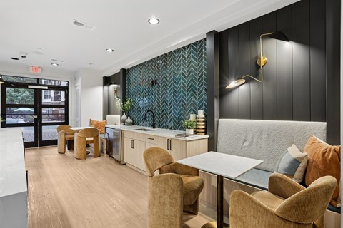 A modern dining area with a table and chairs.
