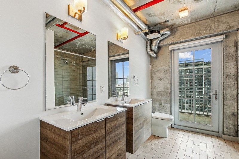 a bathroom with a sink and a toilet and a mirror