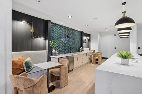 A modern kitchen with a dining table and chairs.