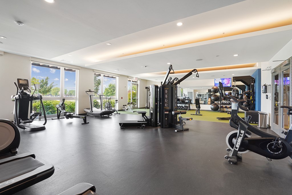 a large gym with a lot of exercise equipment