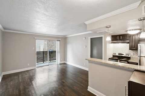 A kitchen with a counter and a microwave.