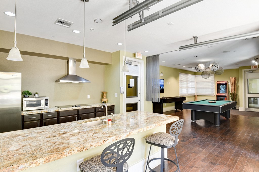 the preserve at ballantyne commons clubhouse with pool table and bar