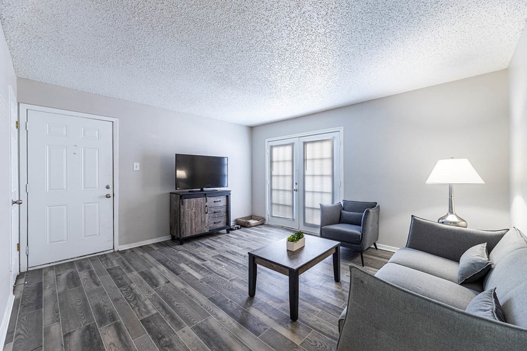 a living room with a couch and a tv