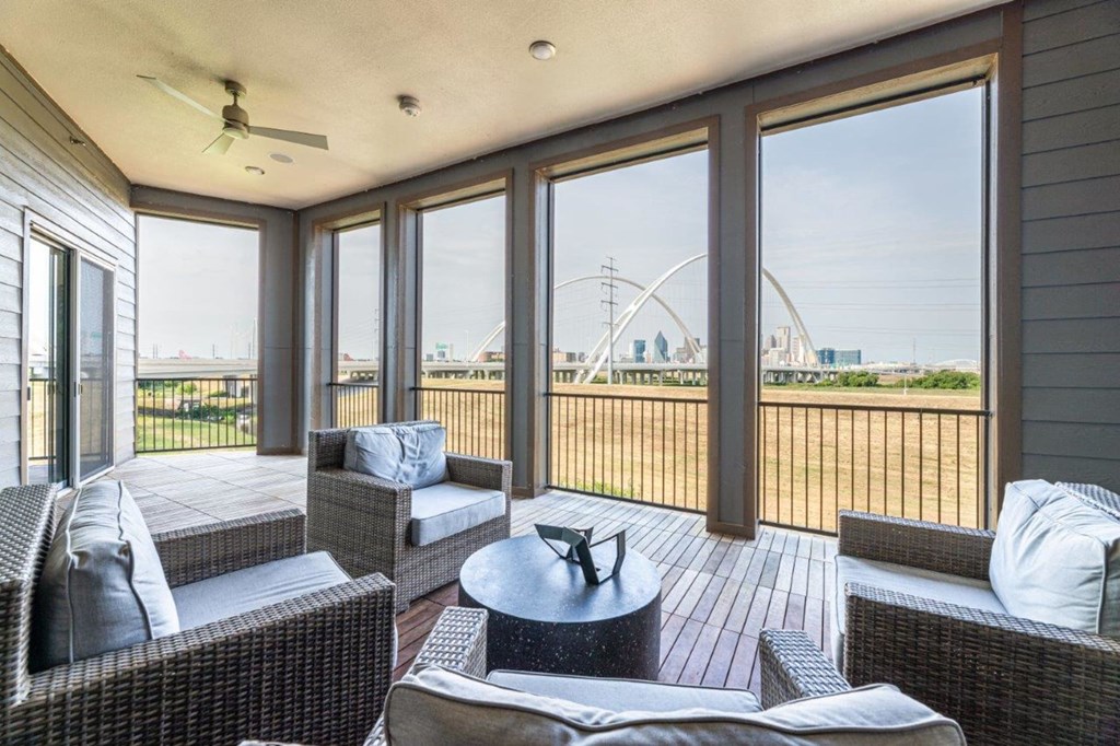 a screened in porch with a view of a ferris wheel