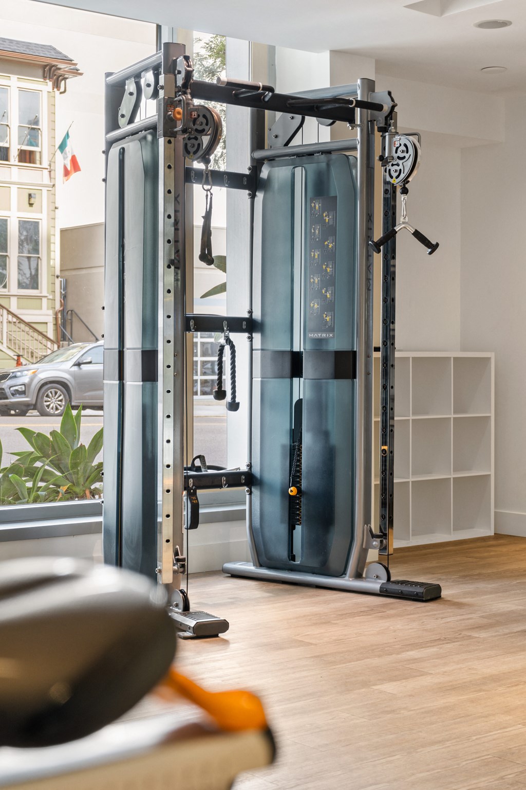 a gym with a pair of exercise machines in a home office