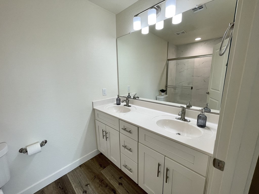 an empty bathroom with a sink and a mirror